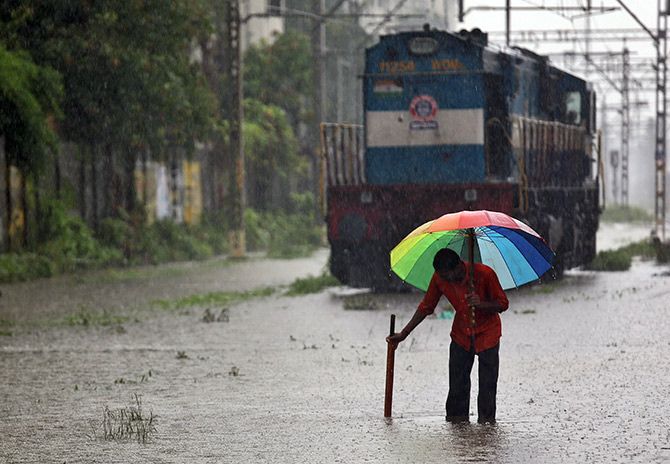 A keyman or gangman's work is much tougher in the monsoons, especially in the Mumbai area. Photograph: Francis Mascarenhas/Reuters.