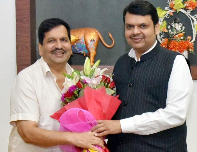 The Bharatiya Janata Party's Mumbai president Mangal Prabhat Lodha, left, greets Maharashtra Chief Minister Devendra Fadnavis in Mumbai on July 17, 2019. Photograph: ANI Photo