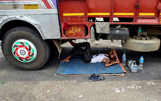 A nap near Agartala, Trupura. Photograph: Jayanta Dey/Reuters.