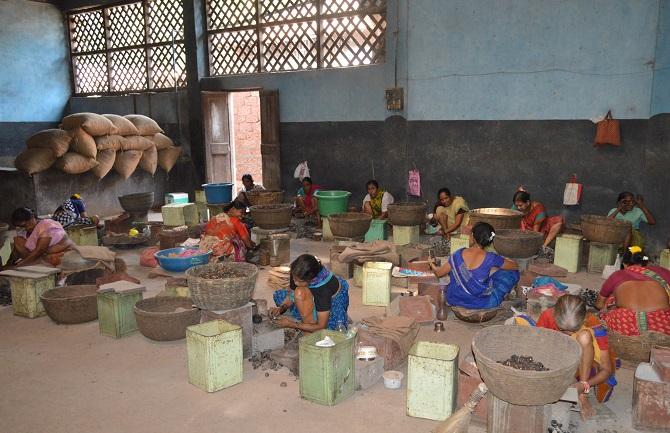 Women working at extracting cashew nuts on a farm. They get work after the cashew harvest, and when the harvest is poor there’s no work to be had. Photograph: Mahipal Soni / Rediff.com