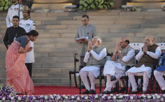 Nirmala Sitharaman exchanges greetings with Prime Minister Narendra Modi after taking oath as a Cabinet minister