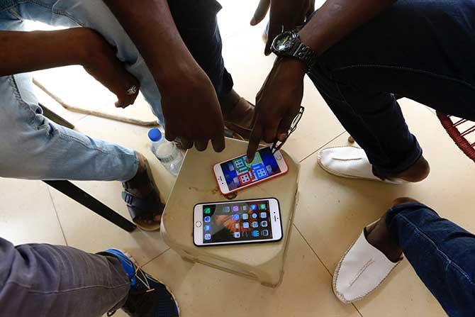 People playing Ludo on their mobile phone 