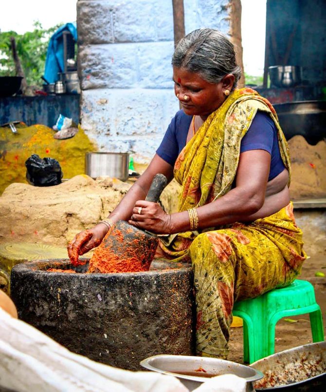 Indian woman making masala