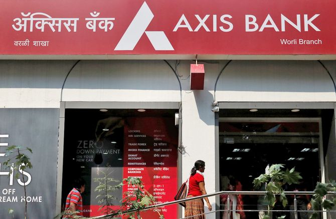 A customer enters a branch of Axis Bank in Mumbai