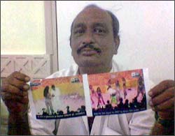 Vinod Jain displaying pictures of Mallika