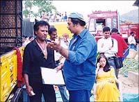 Director Suresh explains a shot to the superstar