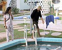 Poonam and Vindu appear shocked to see food floating in the pool