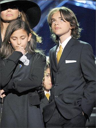 Michael Jackson's children from left:  Paris Jackson, Prince Michael Jackson II (also known as Blanket) and Prince Michael Jackson I stand with their aunt LaToya Jackson (far left) at a memorial service