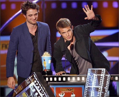 Cam Gigandet (right) speaks next to Robert Pattinson after they won the award for Best Fight.