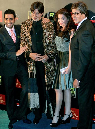 The Bachchans pose with the wax figure of Amitabh