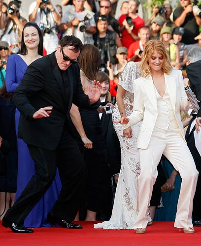 Quentin Tarantino dances on the red carpet with cast member Melanie Laurent