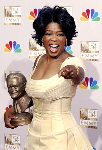 Oprah Winfrey displays her award at the 54th annual Emmy Awards in Los Angeles