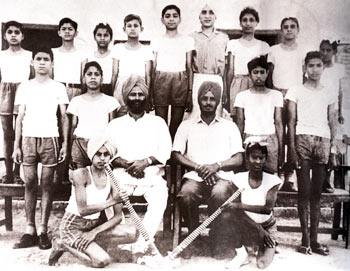 Extreme left in middle row: Om was part of the hockey team in Sanaur Government High School