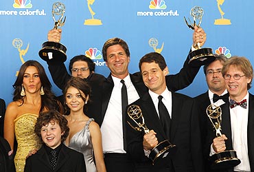 Executive producer Steven Levitan (C) of Modern Family poses with fellow producers and cast members after winning outstanding comedy series
