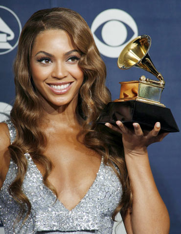Beyonce holds the Grammy for Best Contemporary R and B Album at the 49th Annual Grammy Awards
