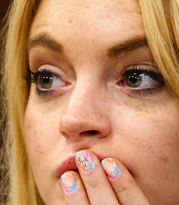 Lindsay Lohan looks on in court before Judge Marsha Revel ruled that Lohan had violated her probation on a 2007 drunken driving charge