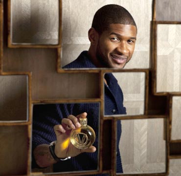 Usher poses for a portrait with a bottle of his new fragrance VIP in New York