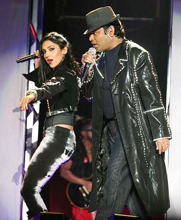 A R Rahman and a singer perform