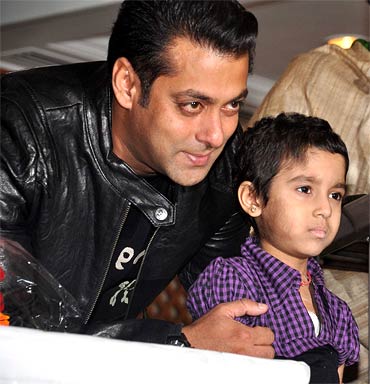 Salman Khan hugs a child