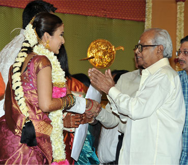 The couple greets K Balachander