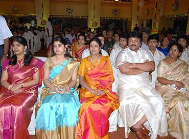 Prabhu sits among the guests