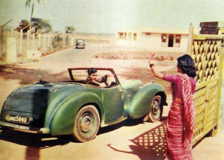 Dev Anand driving off in his green convertible