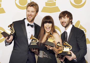 From left to right: Charles Kelley, Hillary Scott and Dave Haywood of country music group Lady Antebellum pose backstage with their awards