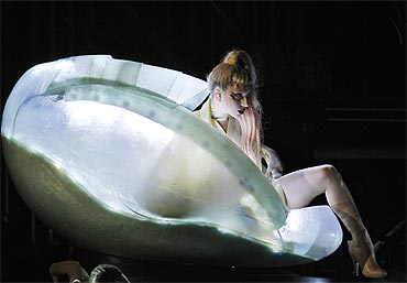 Lady Gaga steps out of a translucent egg to perform her new song Born This Way