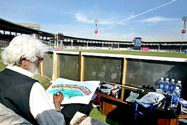 M F Husain at work during a one-day India-Pakistan game in Karachi
