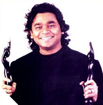 A R Rahman holding his Filmfare trophies