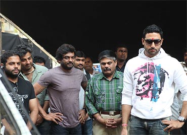 Director Puri Jagannadh (in purple) and Abhishek Bachchan