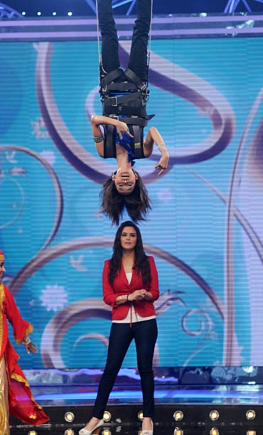 Sourabhee hangs upside down while Preity Zinta watches