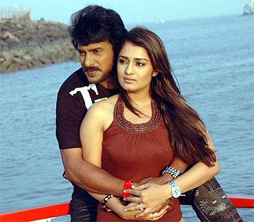 Nikitha Thukral with costar Upendra in Dubai Babu