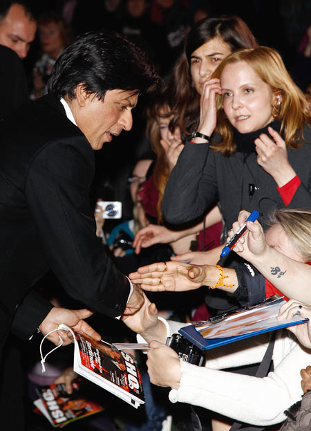 SRK signs autographs for fans