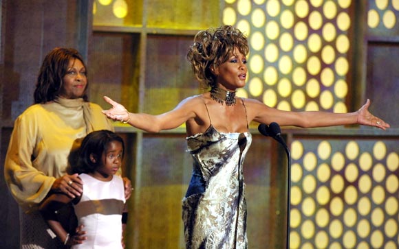 Whitney Houston with mother Cissy (extreme left) and daughter Bobbi Kristina in 2001