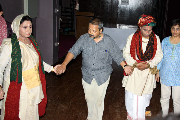 The artistes, including director Sunil Shanbag, pray before the play Sau Saru Jenu Chevat Saru begins in Mumbai