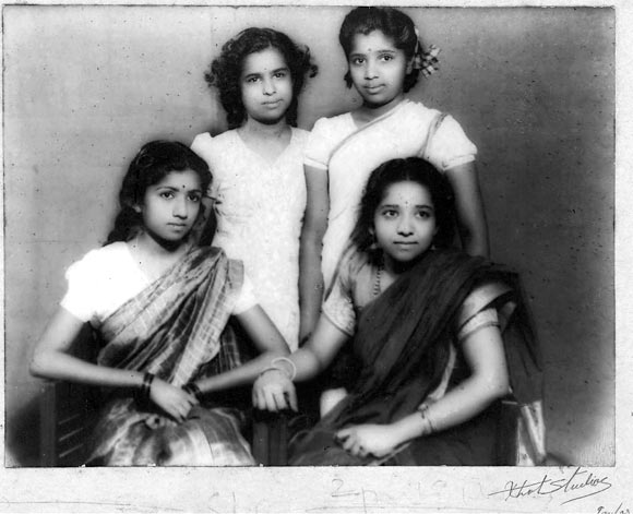 sitting on left Lata Mangeshkar,  standing Meena Mangeshkar and Asha Bhosle