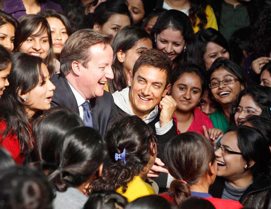 Aamir Khan and British Prime Minister David Cameron, surrounded by students