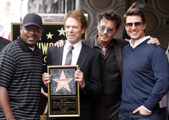 Martin Lawrence, Johnny Depp and Tom Cruise  pose with film and television producer Jerry Bruckheimer