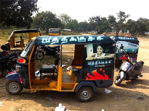 An autorickshaw with the poster of Vathikuchi