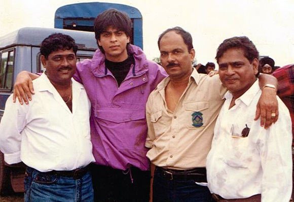 Shashikant Mhatre, second from right, with Shah Rukh Khan on an ad shoot
