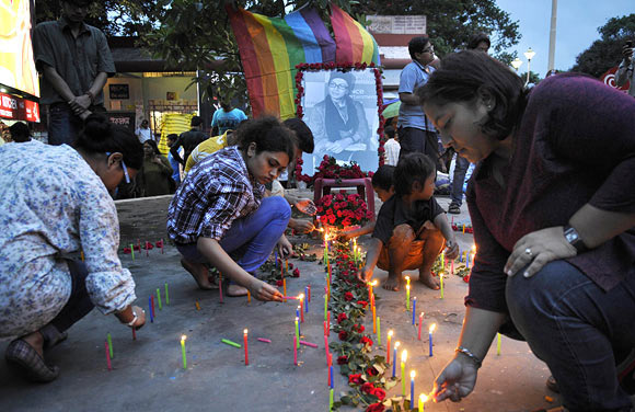 Fans light candles on the streets of Kolkata.