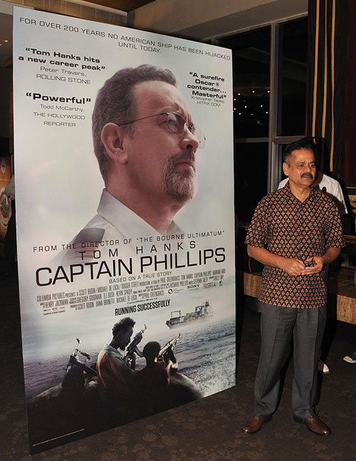 Commander-in-Chief, Western Naval Command, Shekhar Sinha poses with the poster of Captain Philips