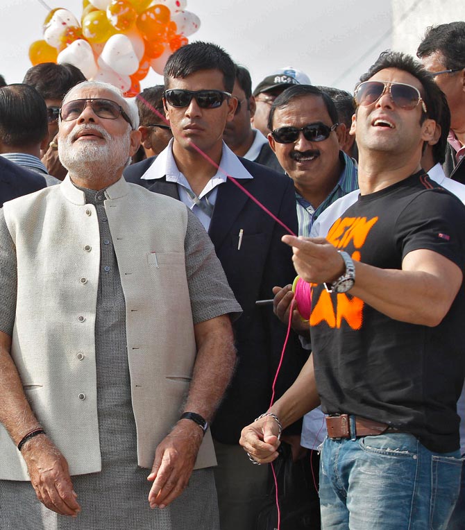 Narendra Modi looks on as Salman Khan flies a kite during a festival in Ahmedabad In January 2014