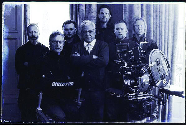 Director Lasse Hallstrom with Om Puri and the crew of The Hundred-Foot Journey.