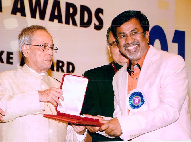 Filmmaker P Sheshadri receives the National award from President Pranab Mukherjee