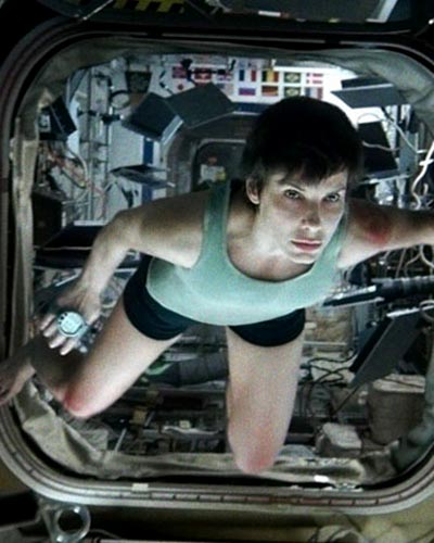 Sandra Bullock in Gravity, inset: Alsonso Cuaron