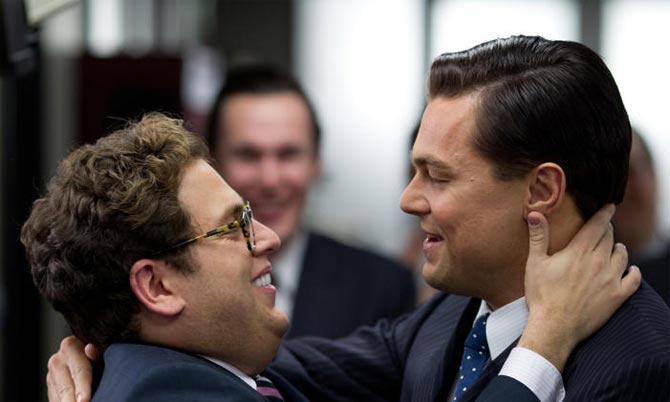 Jonah Hill and Leonardo DiCaprio in The Wolf Of Wall Street, inset: director Alfonso Cuaron