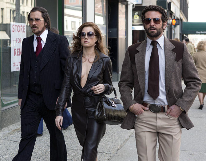 Christian Bale, Amy Adams and Bradley Copper in American Hustle