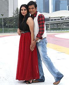 Shivarajkumar and Ramya in a still from Aryan